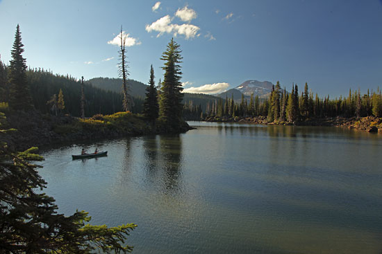 Canoeing in the Cascade Mountains Sparks Lake Canoe, S. Sister, near Bend, Oregon